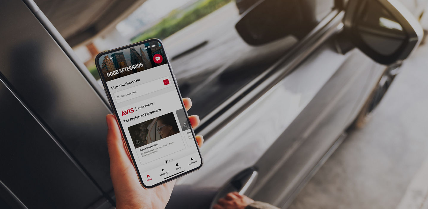 Mockup image of a woman holding and using mobile phone with blank screen while opening the car door