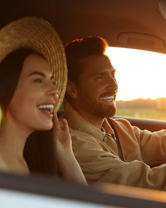 Happy couple enjoying trip together by car, selective focus