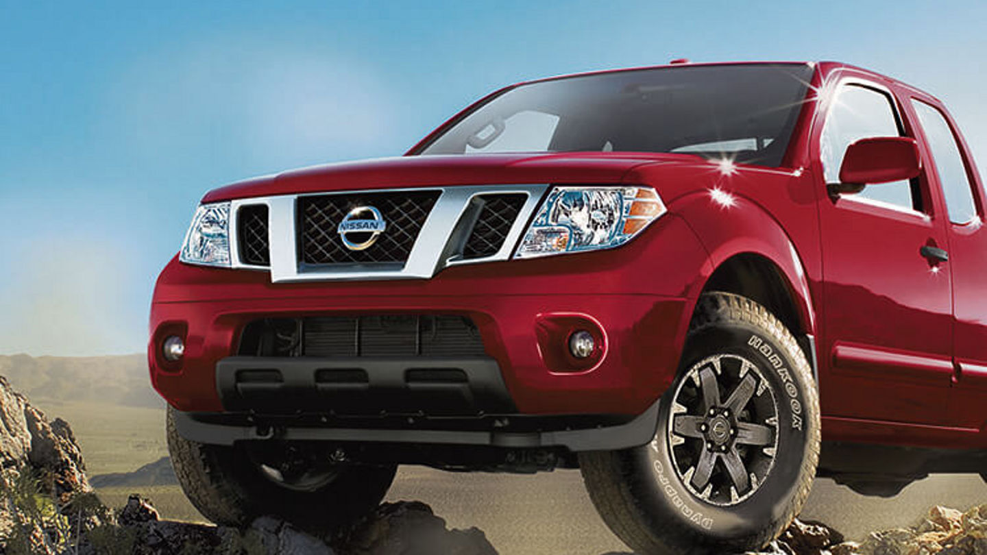 avis-location-red-nissan-frontier-midsize-pickup-truck-on-rocky-terrain-750x750.jpg