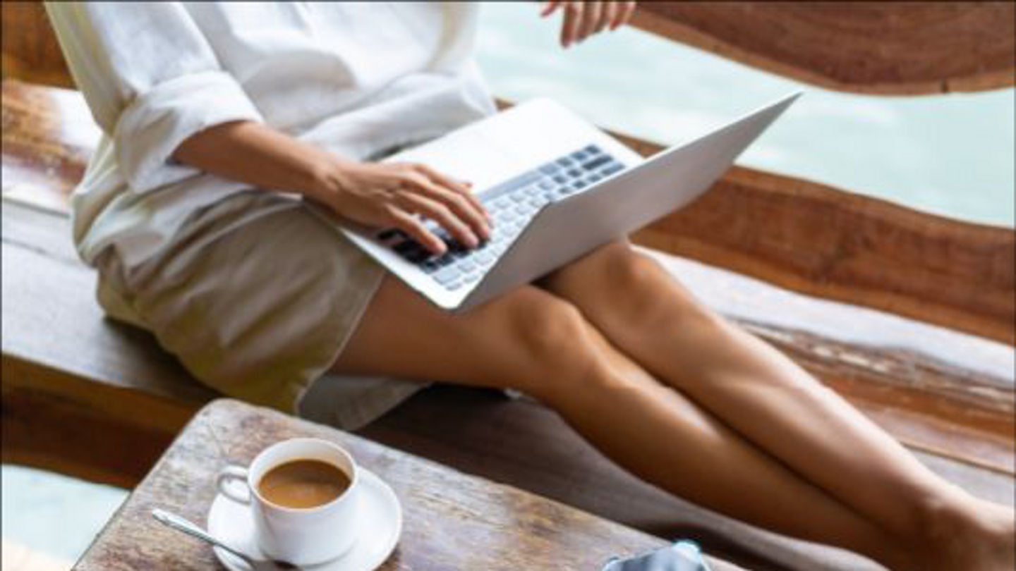 customer-service-woman-on-floor-with-macbook.jpg