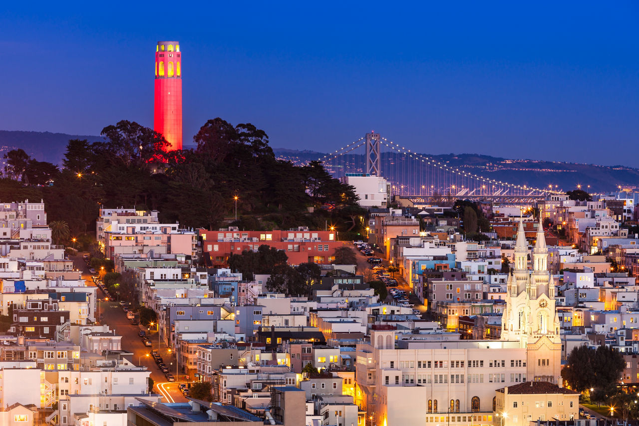 Coit Tower lit up in red and gold in honor of the San Francisco 49ers hosting a 2013 NFL playoff game.