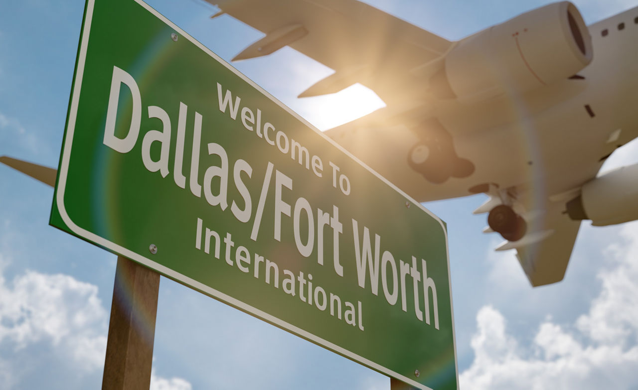 Welcome to Dallas - Fort Worth International Airport Green Road Sign with Airplane Above.